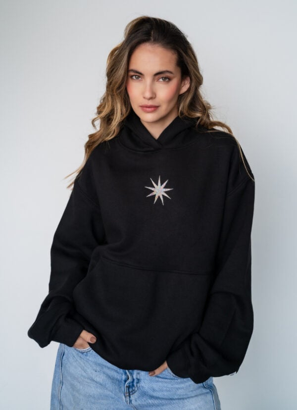 Comfy black hoodie with celestial star embroidery, perfect for casual styles. Made from soft, high-quality fabric for everyday wear.