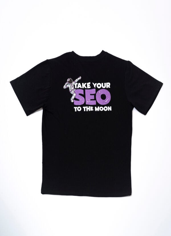 Stylish black SEO-themed t-shirt featuring a fun astronaut graphic and text "Take Your SEO to the Moon", perfect for digital marketing enthusiasts.