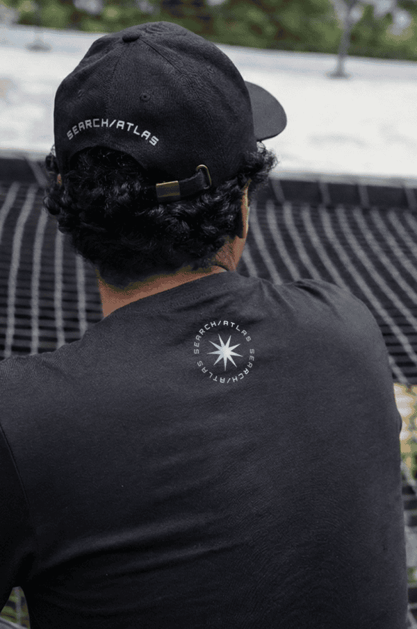 Visor with SearchAtlas logo, black baseball cap for stylish branding and outdoor wear. Perfect for fans and supporters of SearchAtlas adding a modern touch to casual outfits.