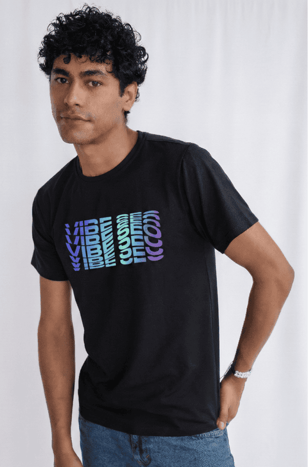 Men's black graphic t-shirt with vibrant "VIBE" text, trendy casual wear, ideal for stylish street looks and daily outfits.